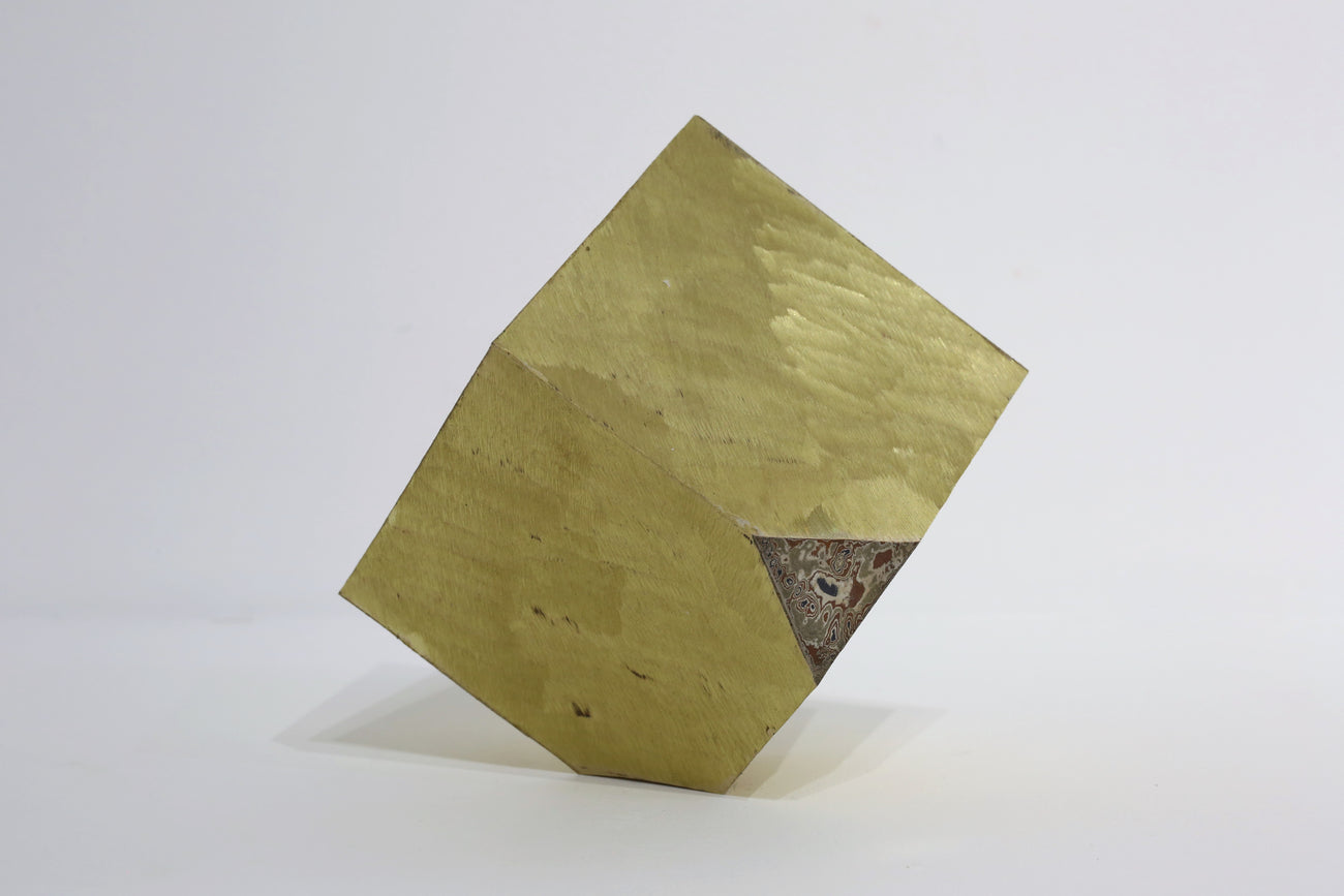 Uncovered Cube #146, MADARA MANJI, 2024Iron, copper, silver, gold, brass25.0 × 25.0 × 25.0 cm